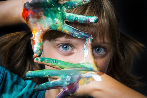 childs hands with paint